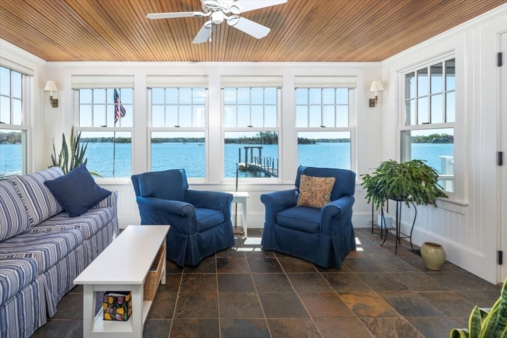 187 Downer Avenue Hingham, MA 02043 - Photo 15 of 42 a living room with furniture and a potted plant