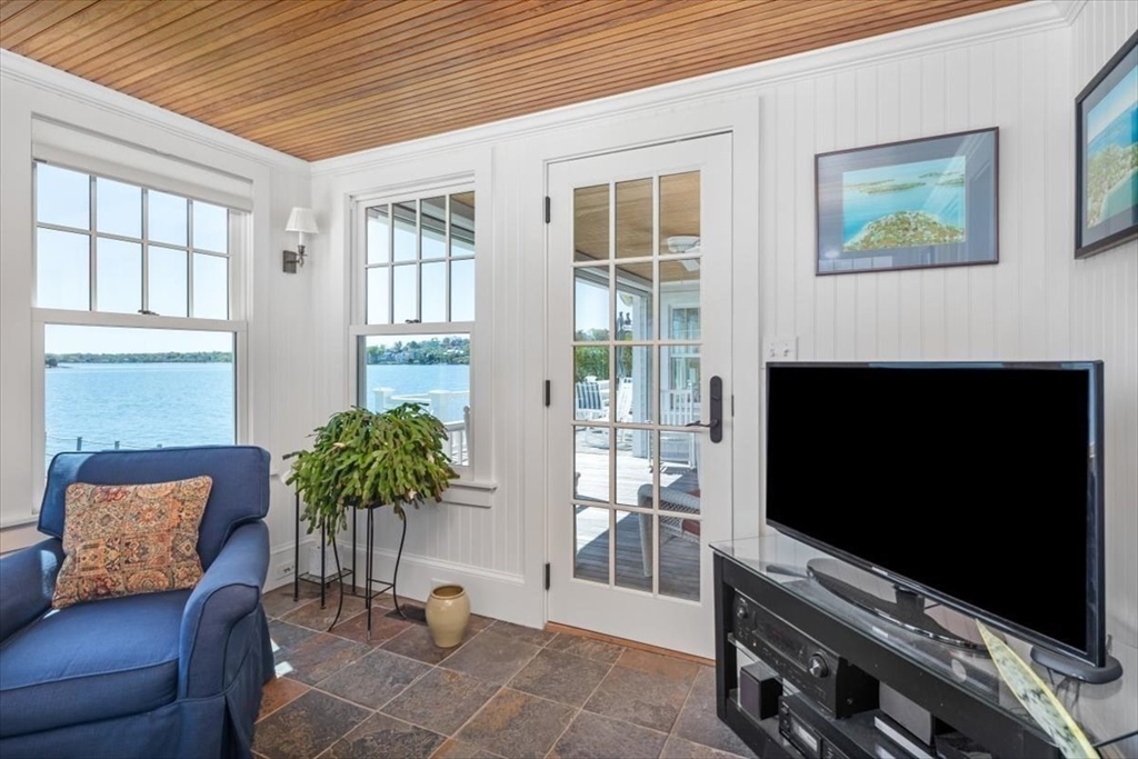 187 Downer Avenue Hingham, MA 02043 - Photo 17 of 42 a living room with furniture potted plant and a flat screen tv