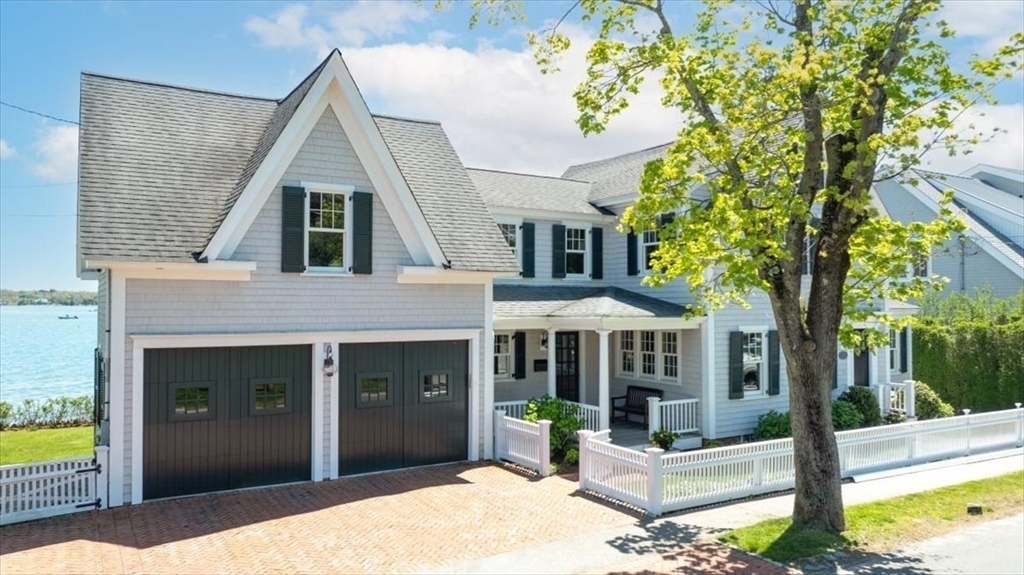 187 Downer Avenue Hingham, MA 02043 - Photo 2 of 42 a front view of a house with garden