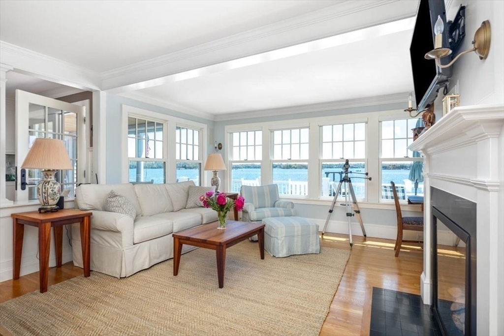 187 Downer Avenue Hingham, MA 02043 - Photo 22 of 42 a living room with furniture and a fireplace