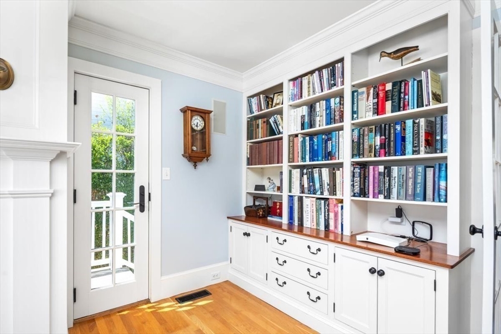 187 Downer Avenue Hingham, MA 02043 - Photo 24 of 42 a view of a workspace with bookshelf