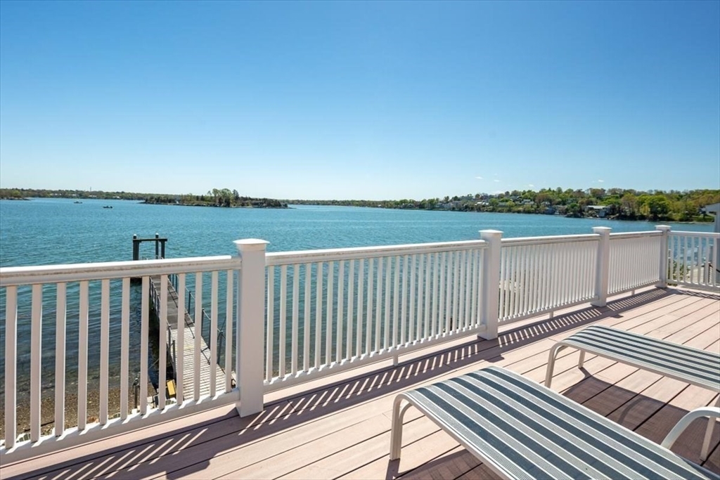 187 Downer Avenue Hingham, MA 02043 - Photo 27 of 42 a view of a balcony with wooden floor and fence