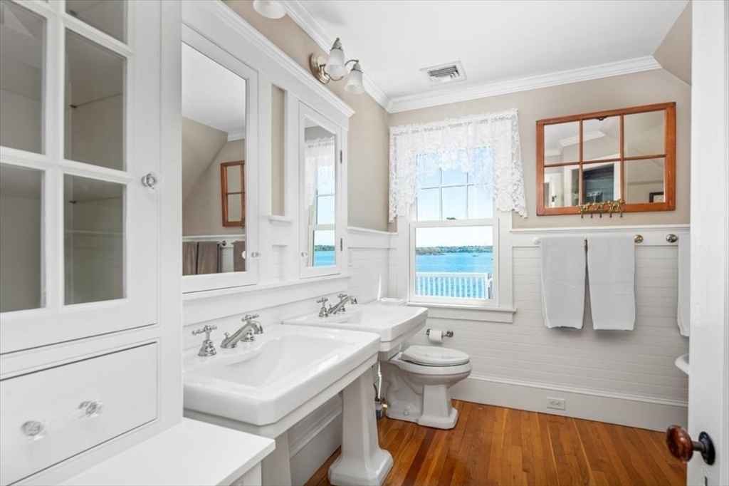 187 Downer Avenue Hingham, MA 02043 - Photo 32 of 42 a bathroom with a sink toilet and shower