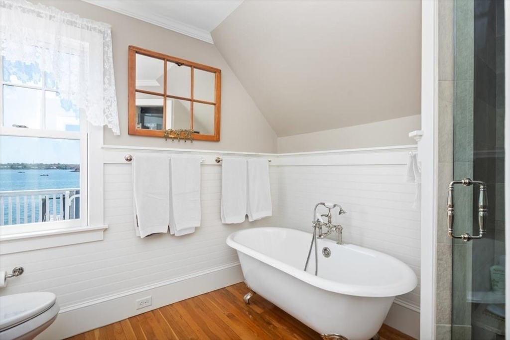 187 Downer Avenue Hingham, MA 02043 - Photo 33 of 42 a bathroom with a sink and a large mirror