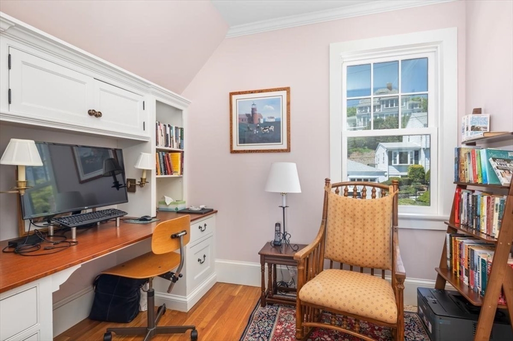 187 Downer Avenue Hingham, MA 02043 - Photo 34 of 42 a room with furniture a flat screen tv and windows