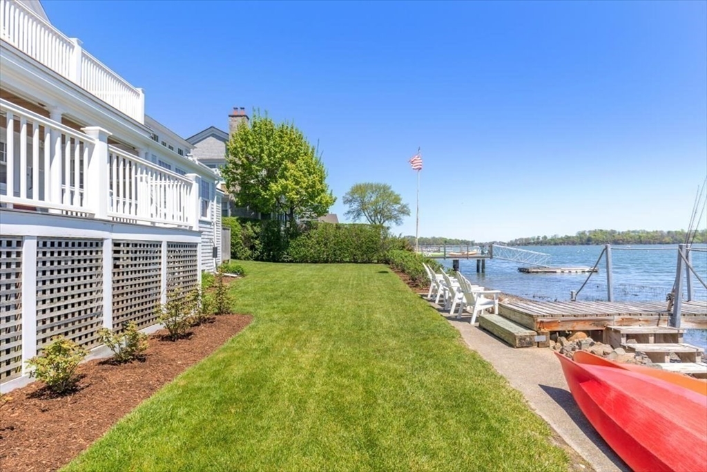 187 Downer Avenue Hingham, MA 02043 - Photo 35 of 42 a view of a backyard with a garden and plants