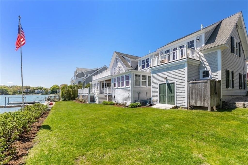 187 Downer Avenue Hingham, MA 02043 - Photo 38 of 42 a view of a house with a big yard and large trees