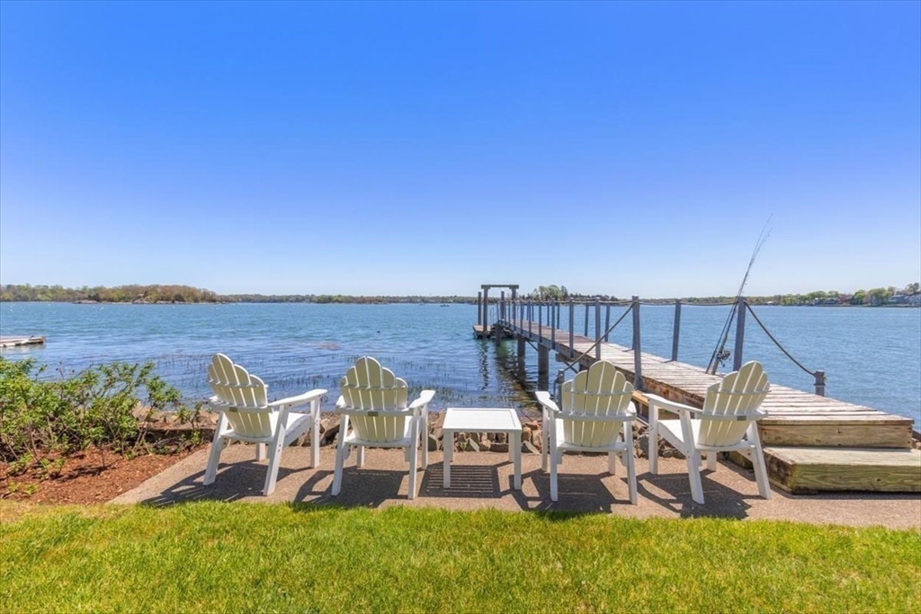 187 Downer Avenue Hingham, MA 02043 - Photo 39 of 42 a view of a chairs and table on the terrace