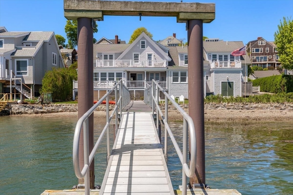 187 Downer Avenue Hingham, MA 02043 - Photo 4 of 42 a front view of a house with a ocean view