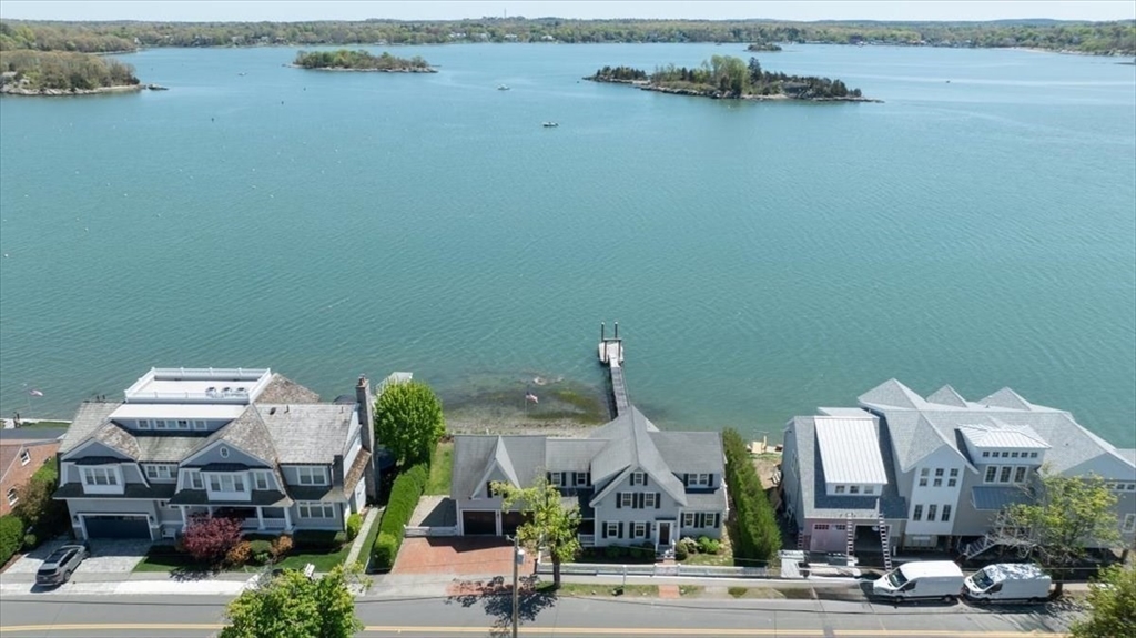 187 Downer Avenue Hingham, MA 02043 - Photo 41 of 42 a building with sitting area and a lake view
