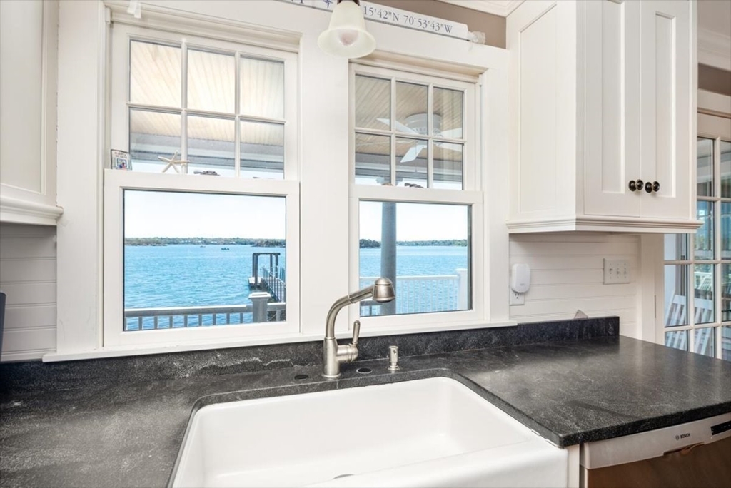 187 Downer Avenue Hingham, MA 02043 - Photo 8 of 42 a bathroom with a granite countertop sink and a window