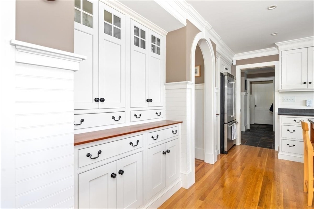 187 Downer Avenue Hingham, MA 02043 - Photo 9 of 42 a kitchen with a refrigerator and a sink