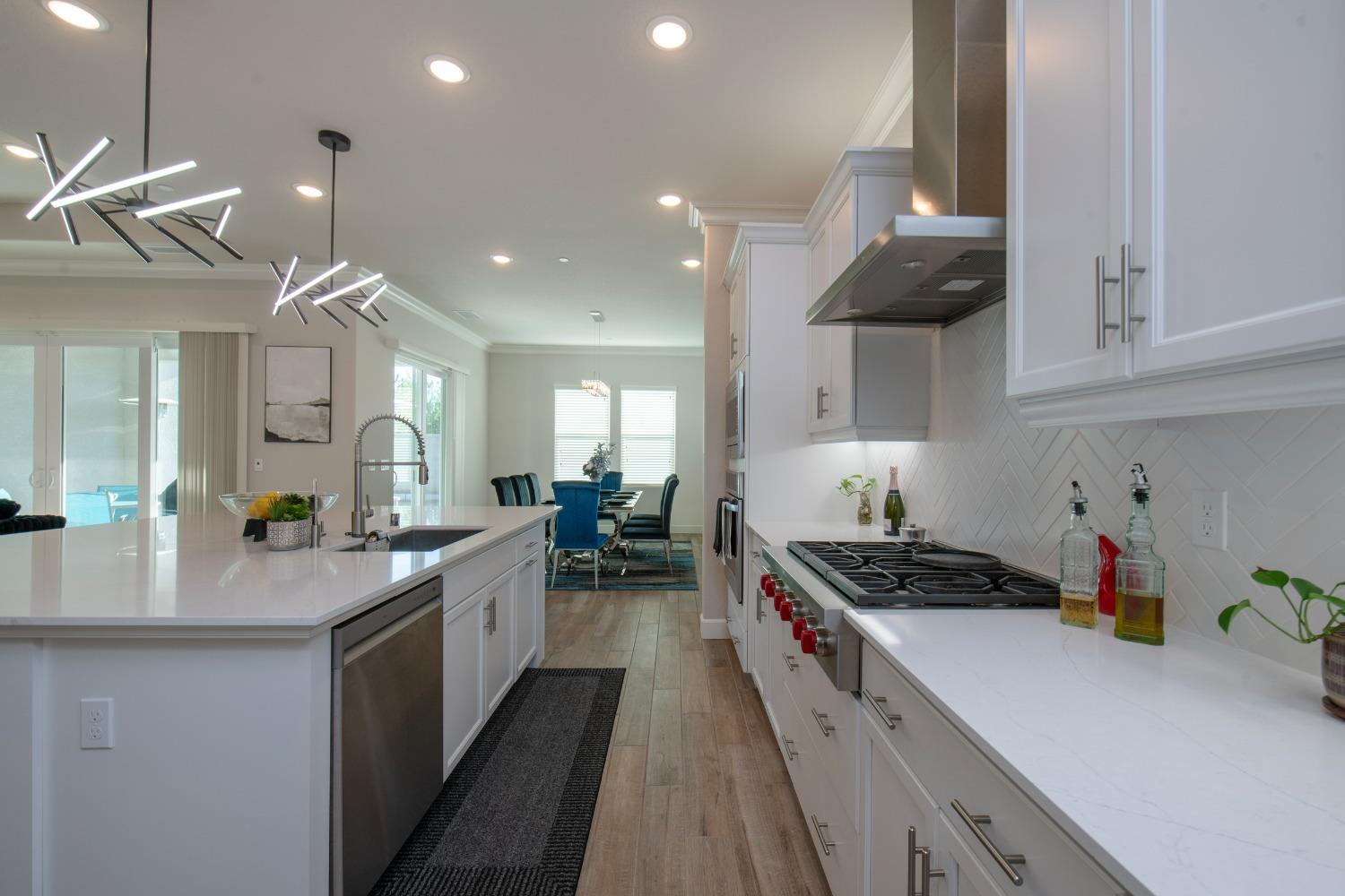 2120 North Perry Avenue Clovis, CA 93619 - Photo 11 of 37 a kitchen with sink a stove and cabinets