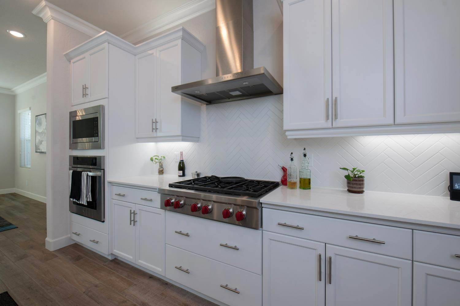 2120 North Perry Avenue Clovis, CA 93619 - Photo 14 of 37 a kitchen with stainless steel appliances granite countertop a sink a stove and a microwave