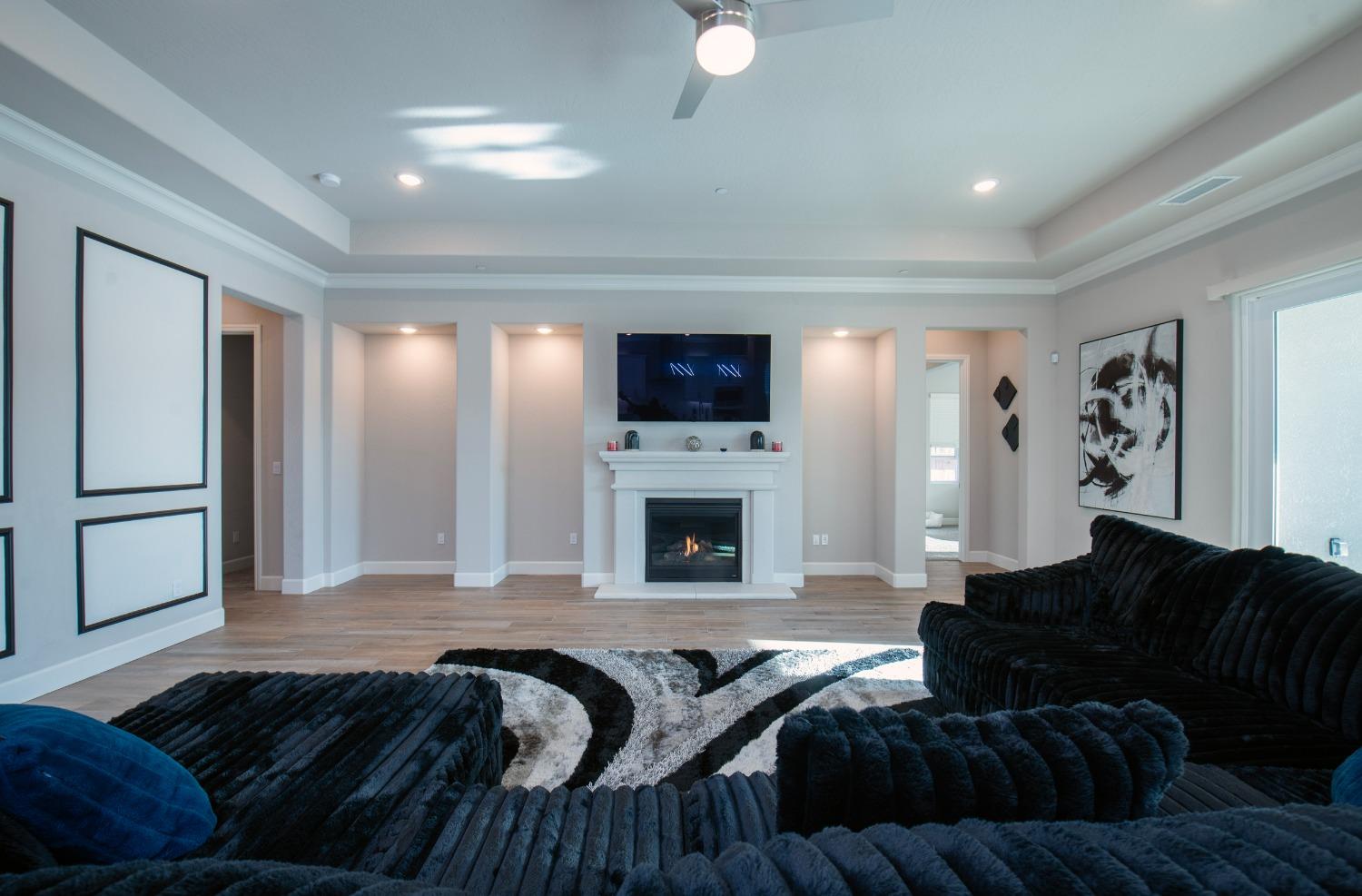2120 North Perry Avenue Clovis, CA 93619 - Photo 18 of 37 a living room with furniture and a fireplace
