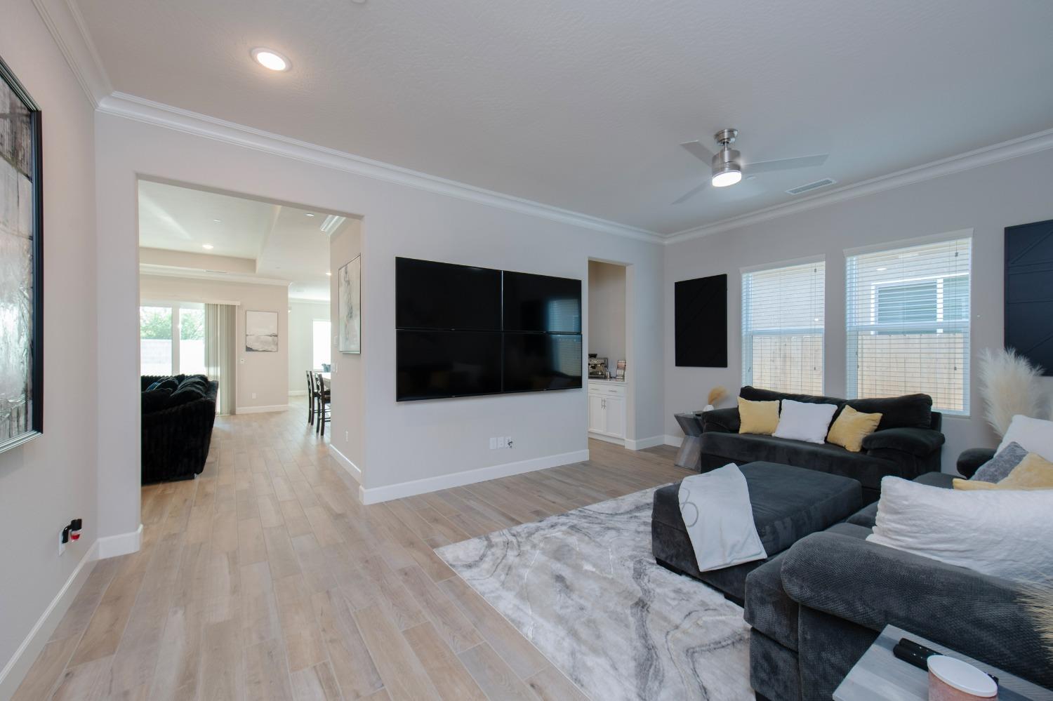 2120 North Perry Avenue Clovis, CA 93619 - Photo 4 of 37 a living room with furniture and a flat screen tv