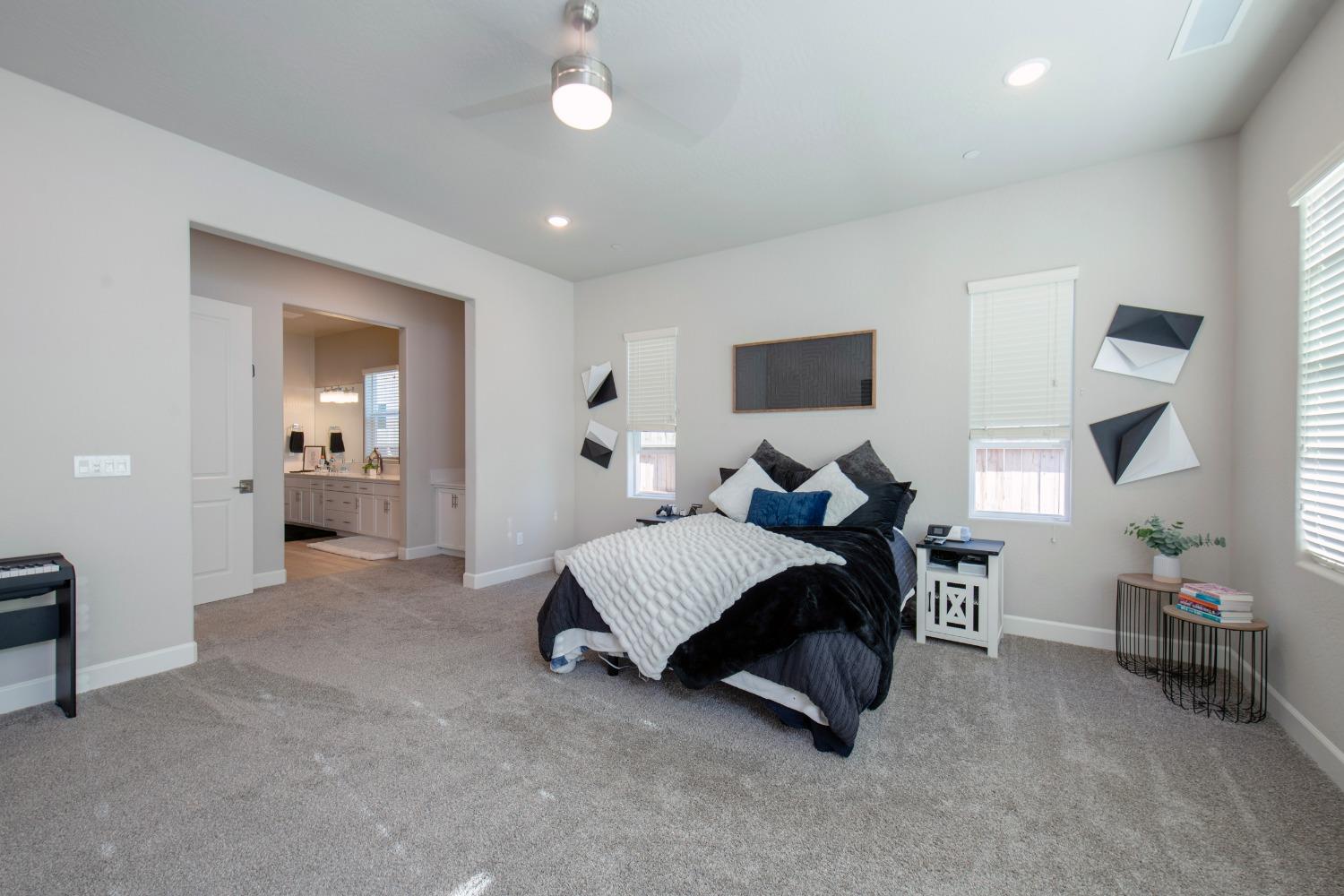 2120 North Perry Avenue Clovis, CA 93619 - Photo 5 of 37 a spacious bedroom with a bed and window