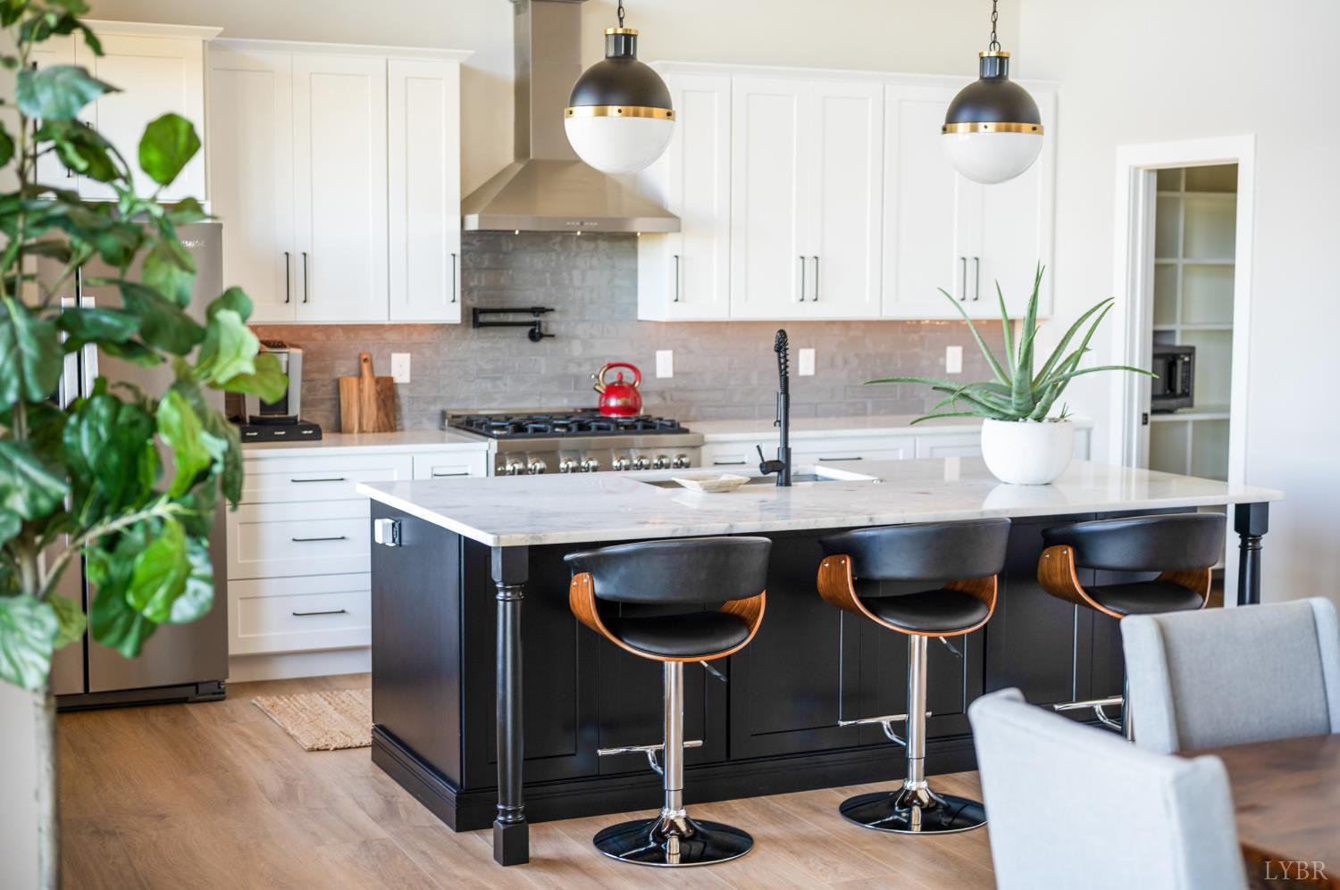 197 Cricket Lane Rustburg, VA 24588 - Photo 13 of 38 a kitchen with granite countertop a sink cabinets and wooden floor