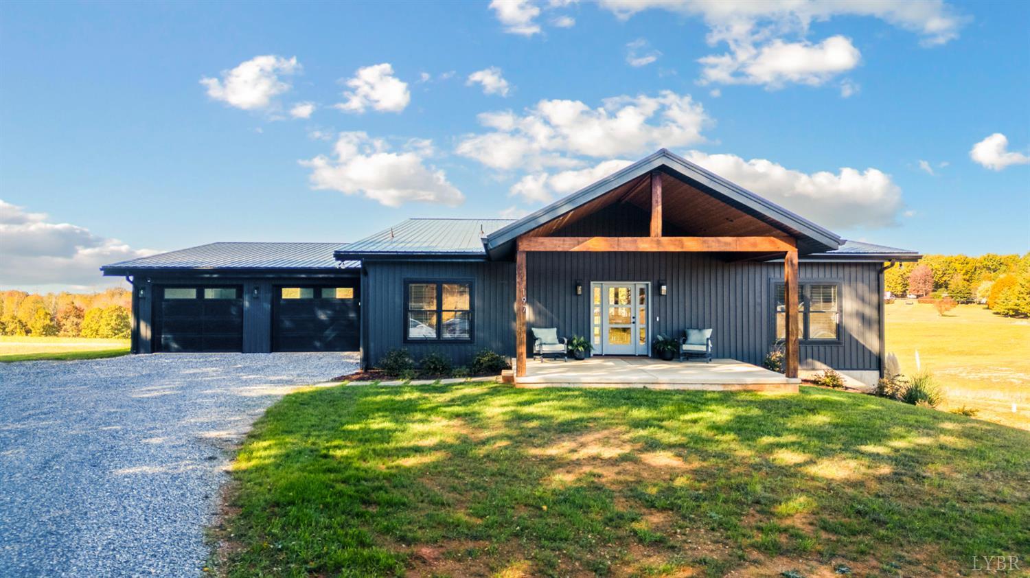 197 Cricket Lane Rustburg, VA 24588 - Photo 2 of 38 a front view of a house with a yard and garage