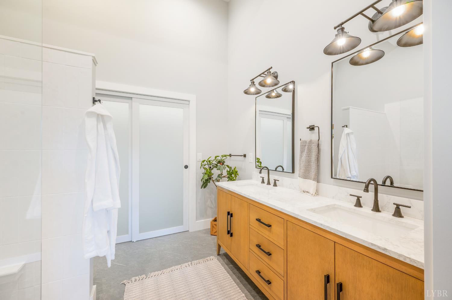 197 Cricket Lane Rustburg, VA 24588 - Photo 21 of 38 a bathroom with a double vanity sink mirror and double