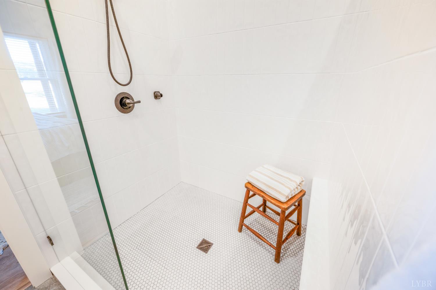 197 Cricket Lane Rustburg, VA 24588 - Photo 23 of 38 a bathroom with a shower and a mirror