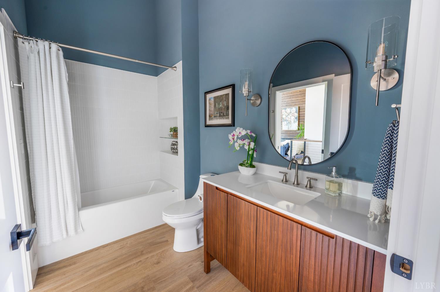 197 Cricket Lane Rustburg, VA 24588 - Photo 25 of 38 a bathroom with a double vanity sink toilet and shower
