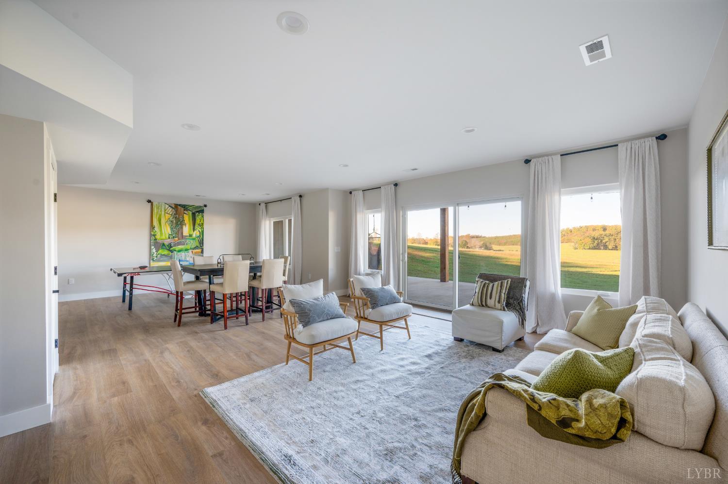 197 Cricket Lane Rustburg, VA 24588 - Photo 27 of 38 a living room with furniture and floor to ceiling windows