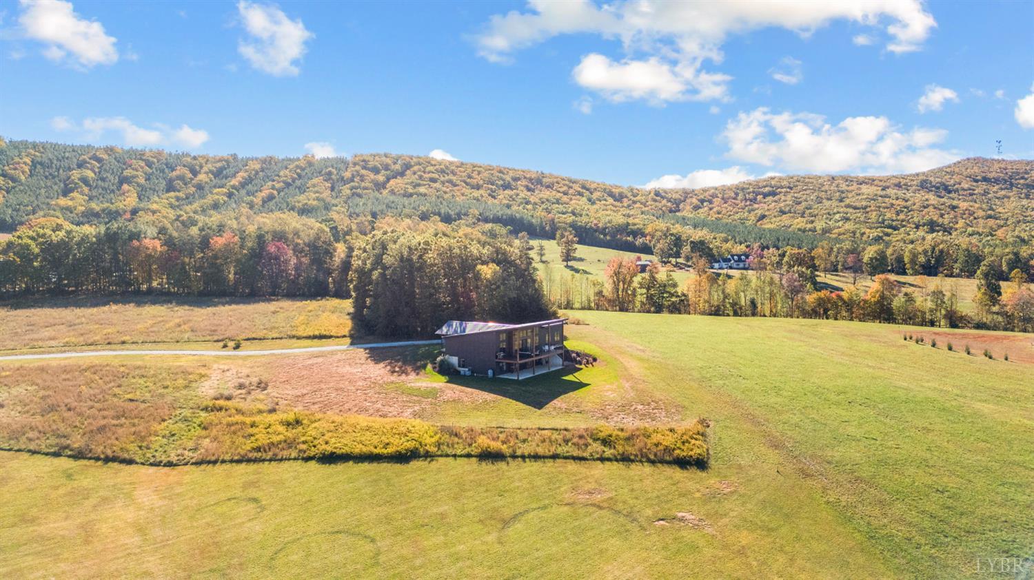 197 Cricket Lane Rustburg, VA 24588 - Photo 5 of 38 a view of a lake with a mountain in the background