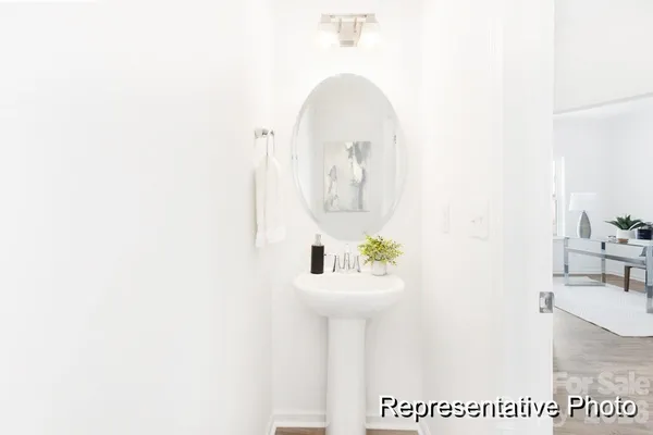 a room with a sink and a mirror