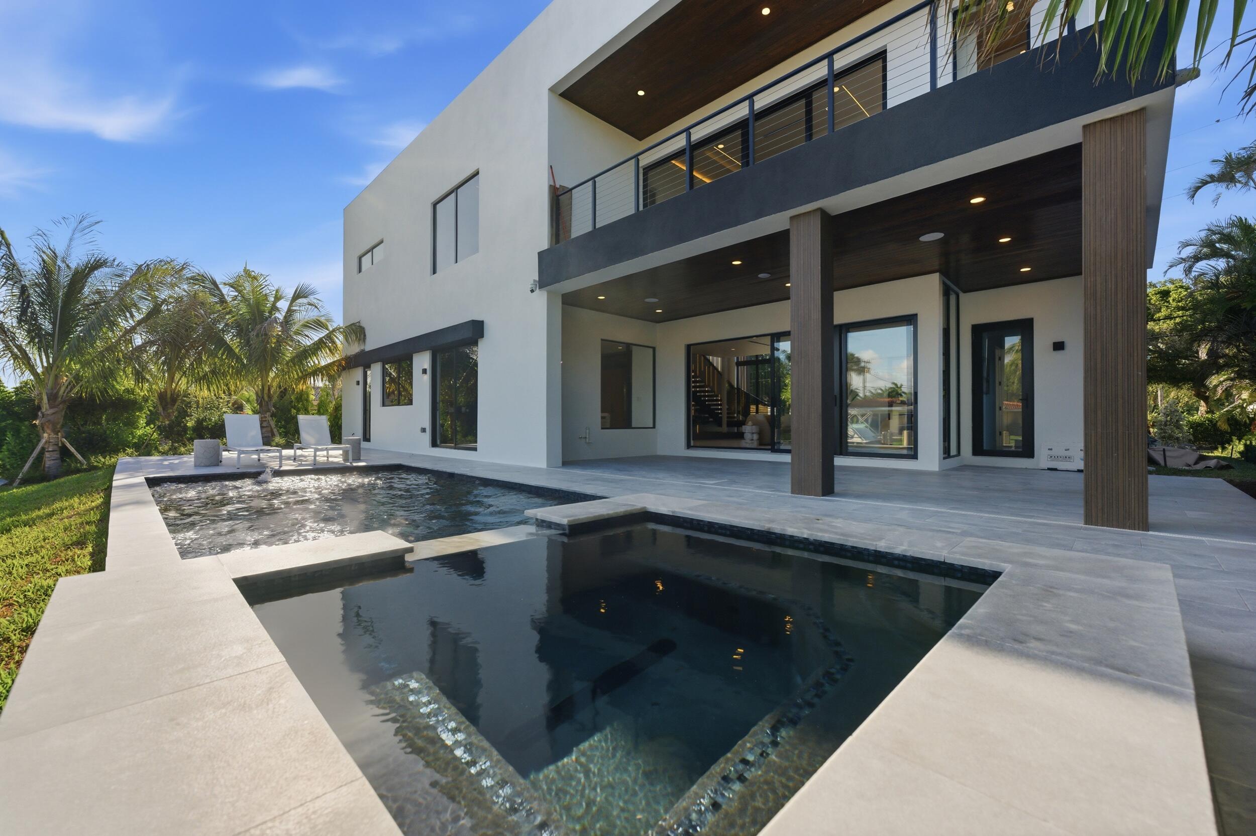 2360 Northeast 49th Street Lighthouse Point, FL 33064 - Photo 23 of 66 a view of swimming pool with outdoor seating