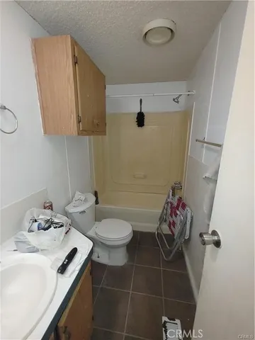 a bathroom with a sink toilet and vanity
