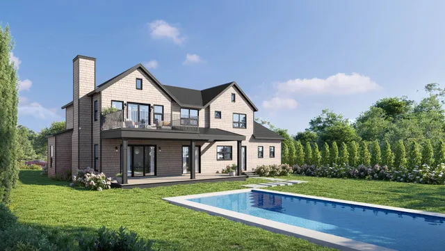 a view of a house with yard and deck