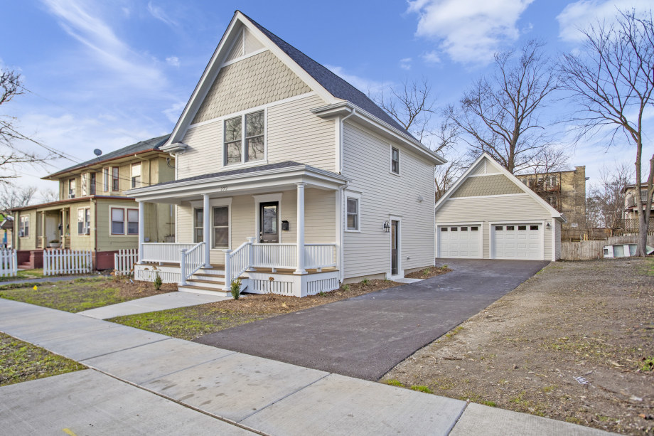 272 North Spring Street Elgin, IL 60120 - Photo 1 of 21 a front view of a house with garden and chairs