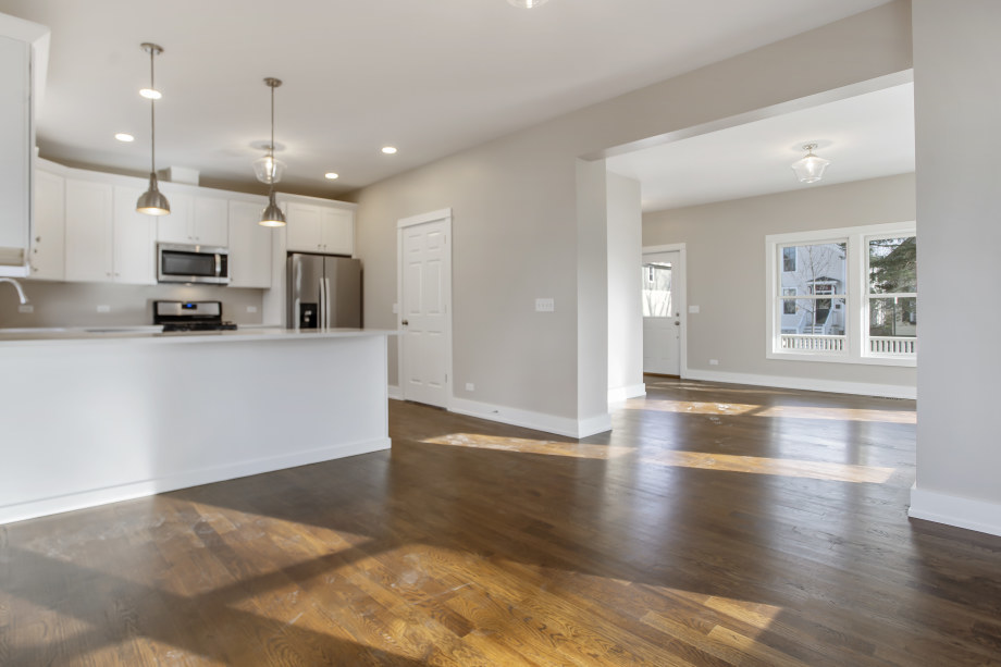 272 North Spring Street Elgin, IL 60120 - Photo 6 of 21 a view of a kitchen with kitchen island a counter top space a sink and appliances