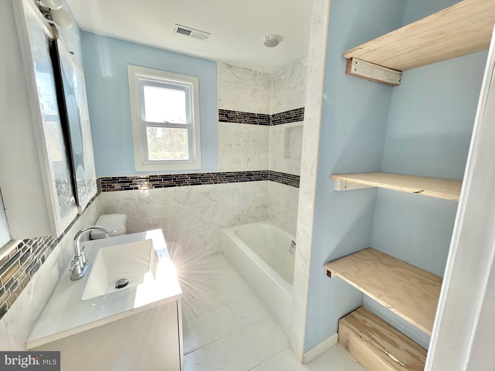 504 Woolman Road Burlington, NJ 08016 - Photo 26 of 62 Main Floor Bathroom and Shelving