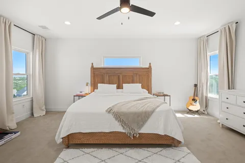 a living room with furniture a rug and a window