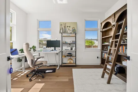 walk in closet with clothes and shoes