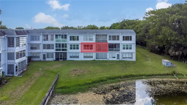 an aerial view of a residential houses with outdoor space