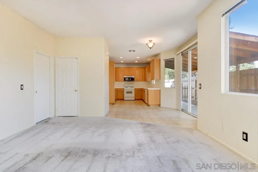 1397 Sunhaven Road Alpine, CA 91901 - Photo 11 of 26 a view of a kitchen with a sink and a refrigerator