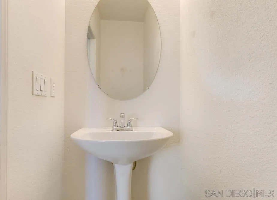 1397 Sunhaven Road Alpine, CA 91901 - Photo 12 of 26 a bathroom with a sink and a mirror