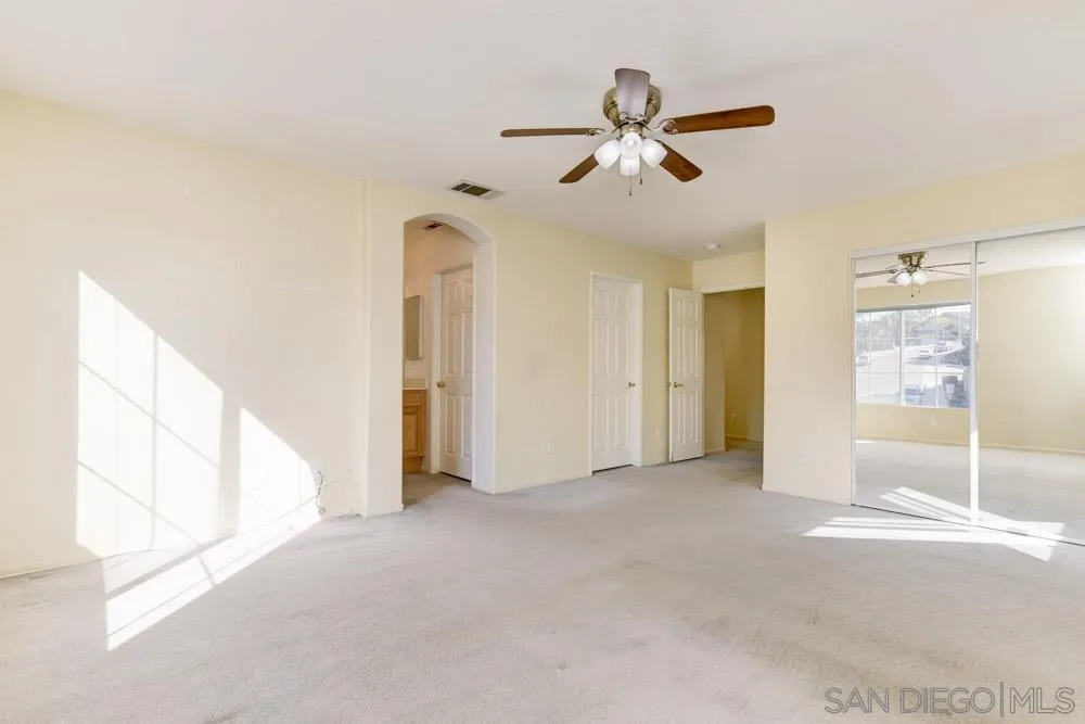1397 Sunhaven Road Alpine, CA 91901 - Photo 21 of 26 a view of a livingroom with a ceiling fan and window