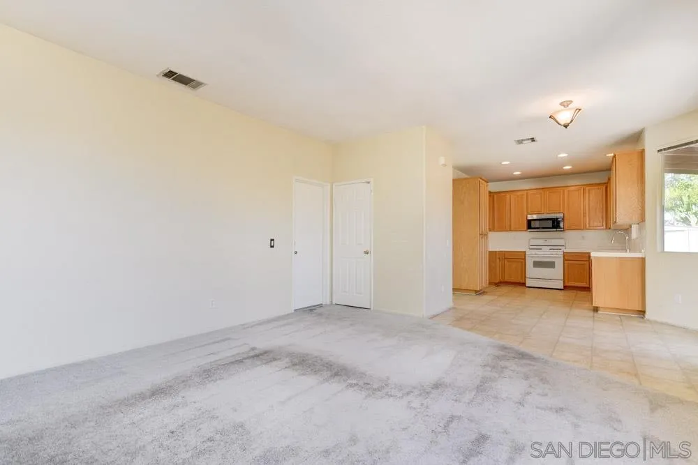 1397 Sunhaven Road Alpine, CA 91901 - Photo 10 of 26 a view of a big room with wooden cabinet and windows