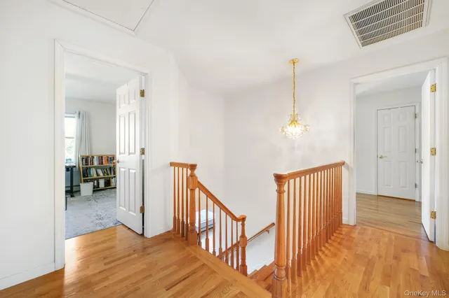 a view of a hallway view with staircase