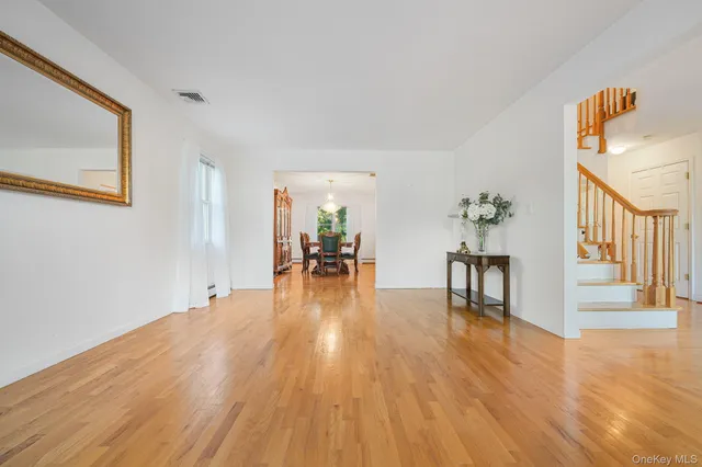 a big room with wooden floor and dining room