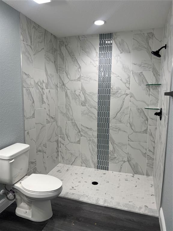 2512 Southwest 147 Place Road Ocala, FL 34473 - Photo 7 of 13 a bathroom with a toilet and a shower