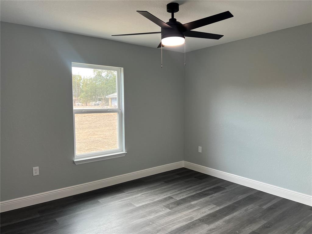 2512 Southwest 147 Place Road Ocala, FL 34473 - Photo 8 of 13 an empty room with a window