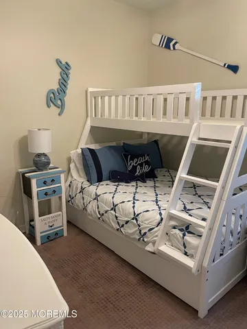 a living room with furniture a rug and a flat screen tv