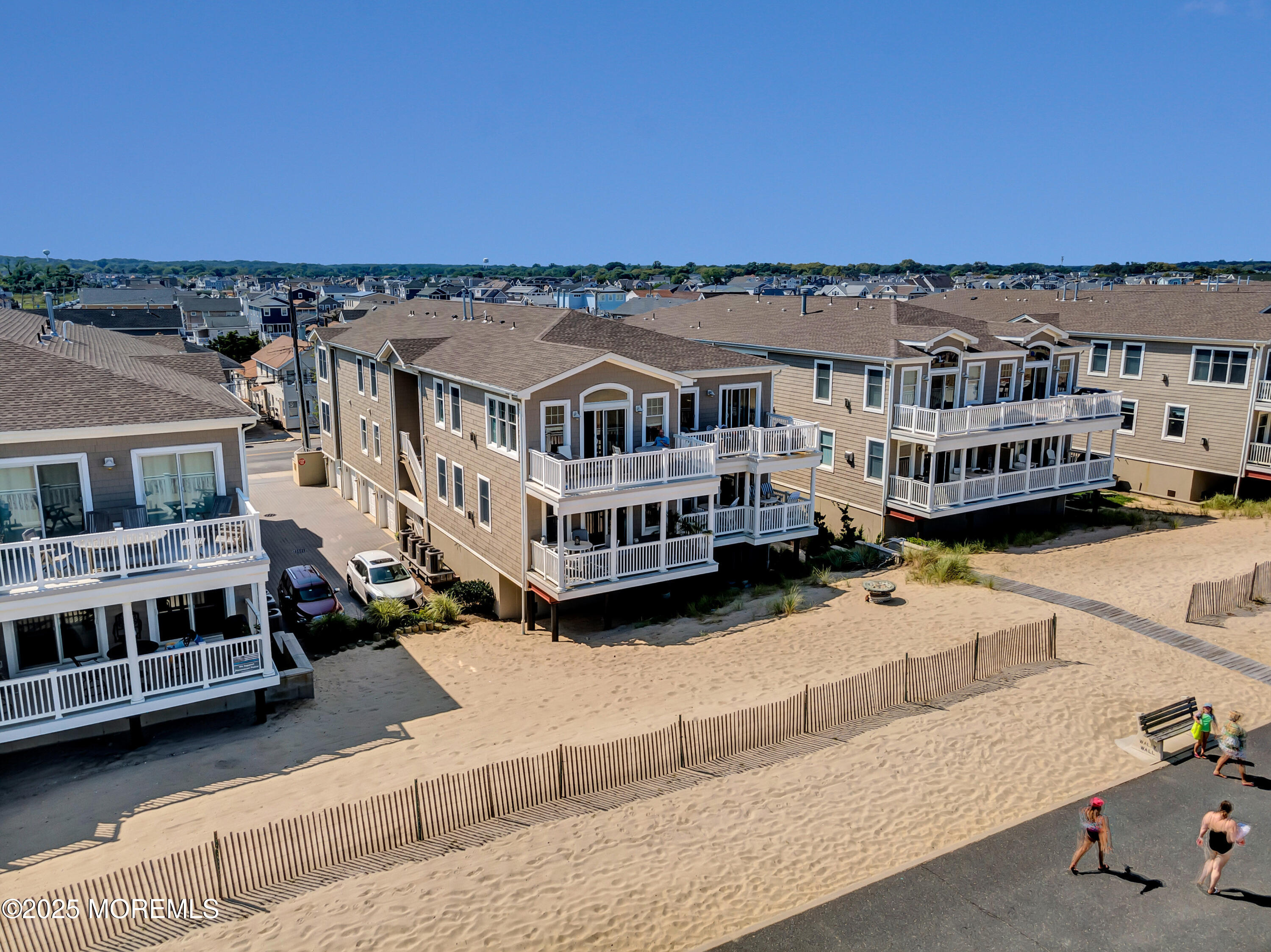 239 Beach Front, Unit 1 Manasquan, NJ 08736 - Photo 23 of 37 a view of a building with a ocean view