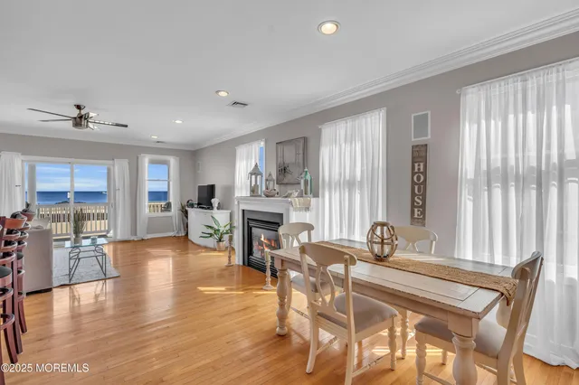 a dining room with furniture and wooden floor