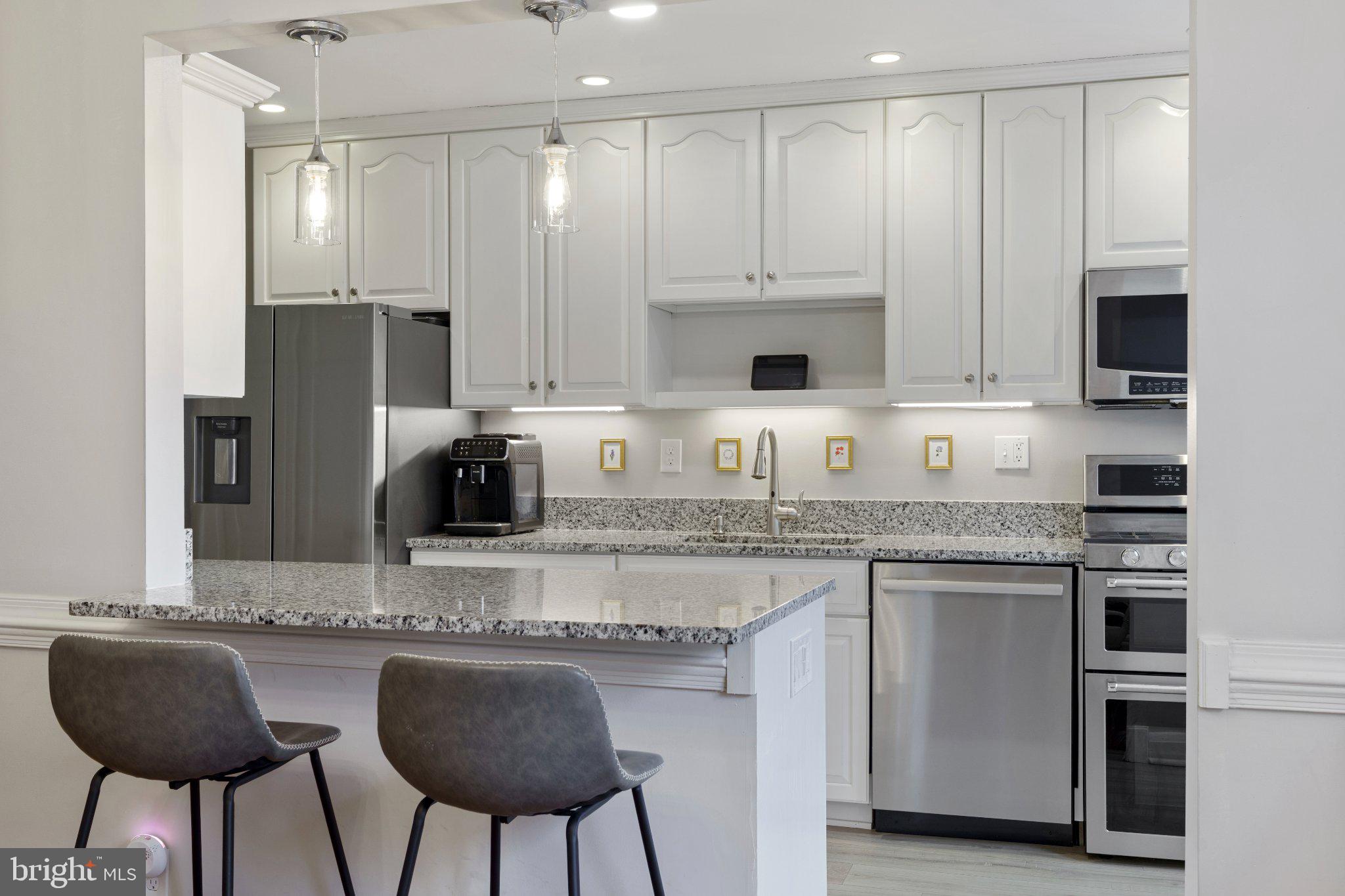 142 Regester Avenue Baltimore, MD 21212 - Photo 15 of 36 Modern kitchen with sleek finishes.
